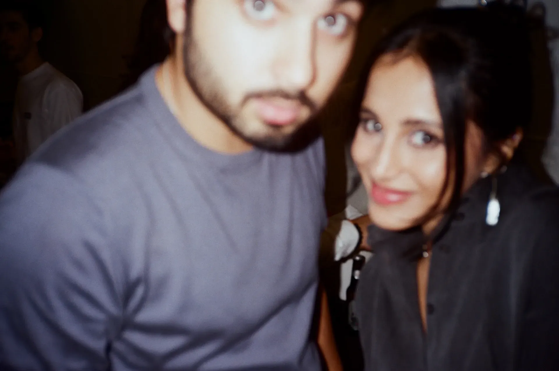 Two guests posing close together for a photo